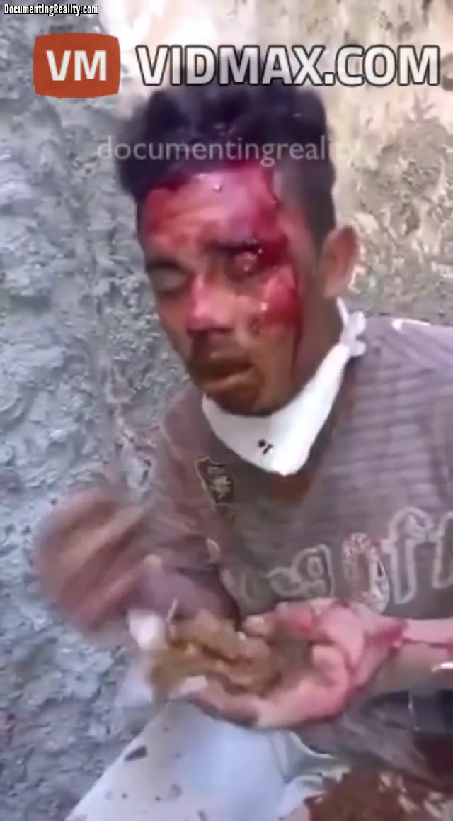 [Graphic] Thief Forced to Eat Mouthfuls of Feces After Being Caught Trying to Steal a Farmers Chickens - Videos - VidMax.com